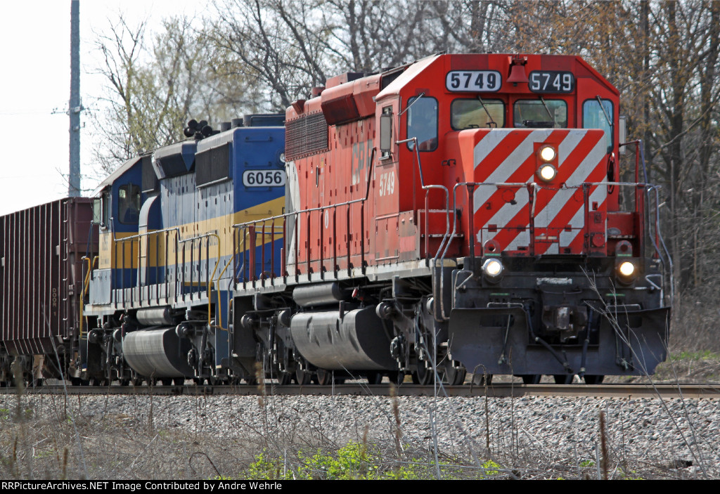 CP 5749 and DME 6056 on a rock train slowing to a stop